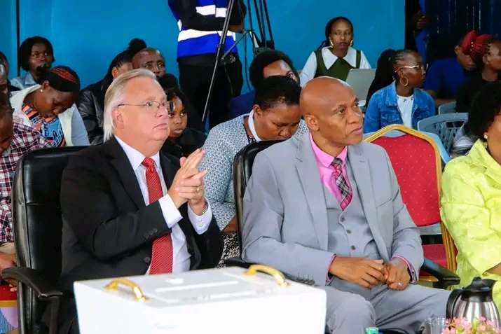 Bishop John Kaberere seated beside a friend of the church