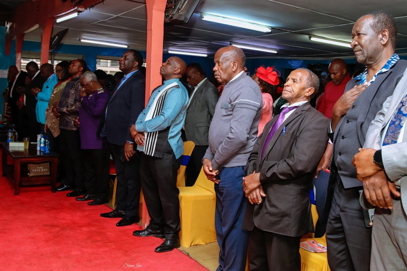 Men of the church standing together in worship